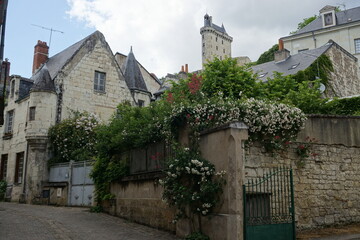 Fototapeta na wymiar old cobblestone street in the town of chinon france under the stone castle 