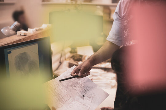Designers looking at neighborhood schematics map