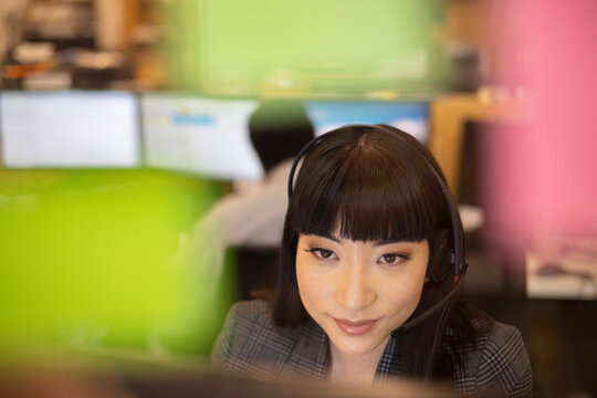 Close up businesswoman in headset working in office