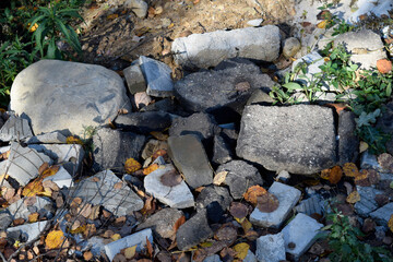 stones and broken tiles on the ground
