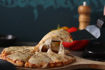 Delicious pizza with a sophisticated background of cheese and vegetables