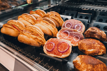 Traditional in german cuisine - mett sandwich with minced meat and onions for sale on a shelf of supermarket or fastfood cafe