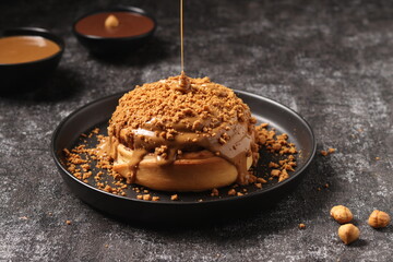 Delicious Cinnabon painted on a dark black background