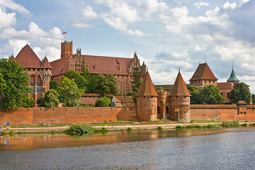 Naklejka na ściany i meble medieval castle Malbork at the riverbank in Poland