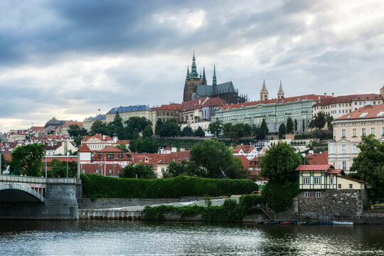 View of the left bank of the Vlatva River in Prague and the Prague Castle towering above it.