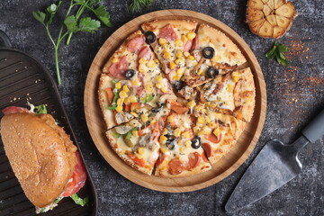 Delicious pizza with a sophisticated background of cheese and vegetables