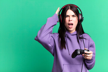 gamer woman playing with headset and a controller