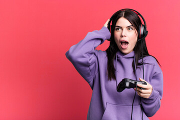 gamer woman playing with headset and a controller