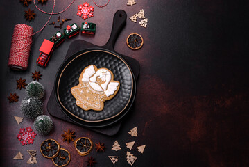 Fototapeta na wymiar Beautiful different Christmas decorations and gingerbread on a brown concrete table