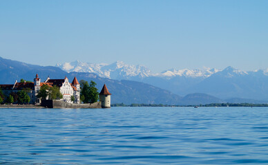 the beautiful island of Lindau on lake Constance (lake Bodensee) with the snowy Swiss Alps in the...