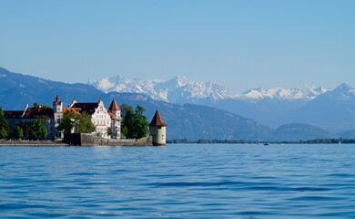 the beautiful island of Lindau on lake Constance (lake Bodensee) with the snowy Swiss Alps in the...