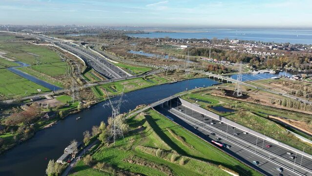 Aqueduct Vechtzicht Muiden in The Netherlands. Infrastructure road, highway. river, waterway crossing and tunnel. connection between Diemen and Almere. Aerial drone view.