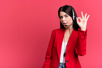 feeling happy, showing approval with okay gesture. telemarketer with a headset concept