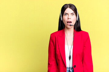 looking very shocked or surprised. telemarketer with a headset concept