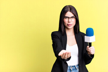 smiling happily with friendly and  offering and showing a concept. journalist or presenter with a...