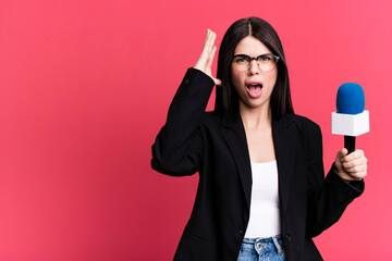 screaming with hands up in the air. journalist or presenter with a micro