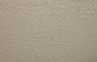 closeup of rough grey wall surface texture pattern interiors in the building, detail of design backdrop. empty rugged gray wallpaper