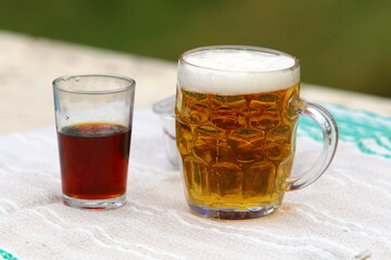 In a glass of fresh and cold beer.