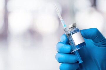 Vaccination concept. Doctor hold vial of vaccine