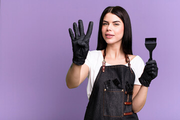 smiling and looking friendly, showing number four. hairdesser concept