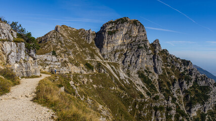 Mountain trail road in Mount Pasubio in the Italian Alps during fall season