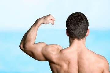 Young sporty strong sportsman train