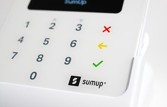Viersen, Germany - November 9. 2022: Closeup of isolated white mobile sumup air card payment reader terminal with keyboard