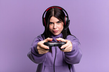 young gamer woman with a headset and a contoller
