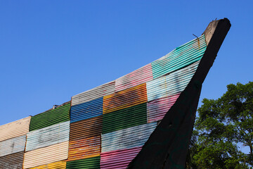 Colorful asbestos building with clear blue sky in the morning - obrazy, fototapety, plakaty