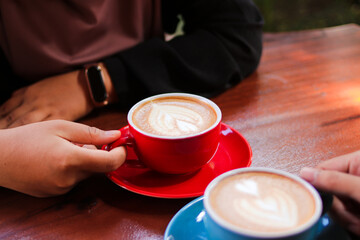Young couple in love having breakfast in a coffee shop