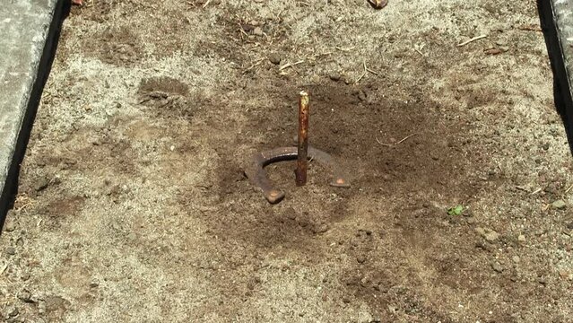 Pit With Pole Sand And Three Horseshoes Landing One A Ringer
