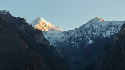 Fototapeta premium Mountainous landscape in autumn season at Hunza valley, Pakistan. Snowy peaks, rocky mountains