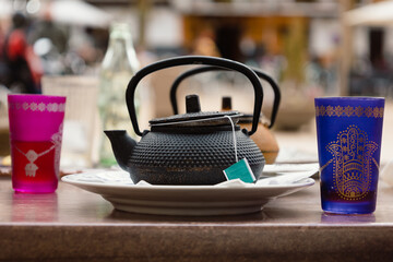 Teapot with infuser and colorful cups