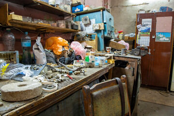 The interior of a room with clutter and different objects
