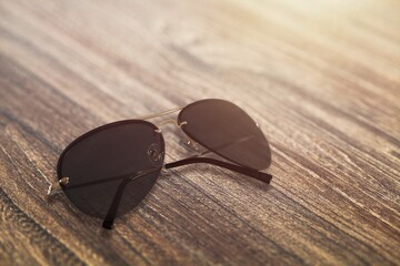 Beautiful trendy modern sunglasses on the desk