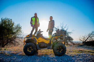 Obraz premium Couple riding a quad bike