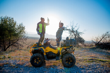 Fototapeta premium Couple riding a quad bike