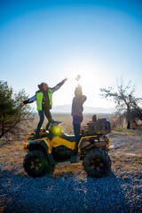 Obraz premium Couple riding a quad bike