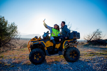 Obraz premium Couple riding a quad bike
