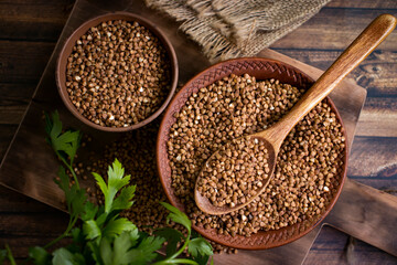 Dry buckwheat, parsley on old background