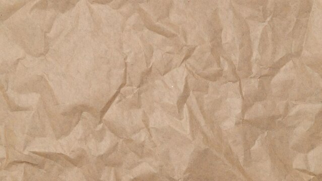 Stop motion animation of Crumpled brown paper texture background.