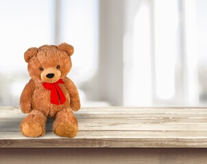 Cute soft toy bear on the desk.