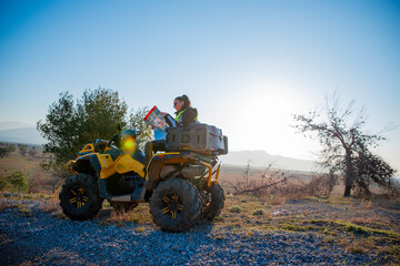 Obraz premium Girl riding a quad bike