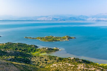 Shtegvashe Viewpoint. Beautiful summer landscape of small green islands and blue waters of Lake Skadar near the border with Albania. Montenegro.