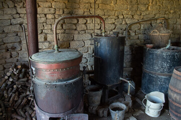 Old still for making alcohol by heating fruit. It is a device intended for the separation of...