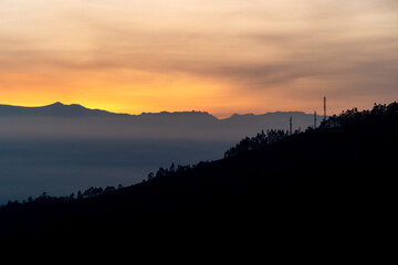 Magical purple and pink sunrise or sunset in the mountains