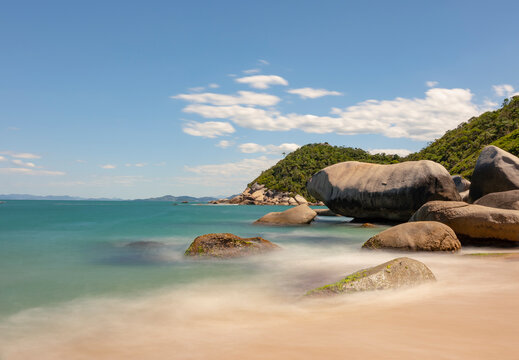 A clear blue sky day at Tainha Beach, a cristaline water paradise in Bombinhas, Santa Catarina, Brazil