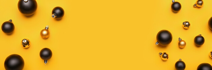 Many Christmas balls on yellow background with space for text, top view