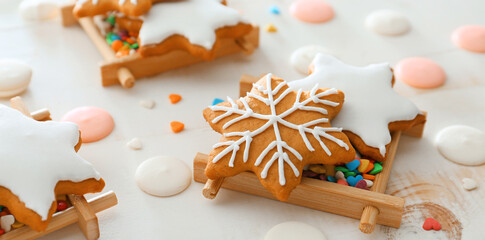 Tasty Christmas cookies and chocolate chips on white wooden background