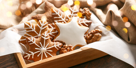 Box with tasty Christmas cookies on table